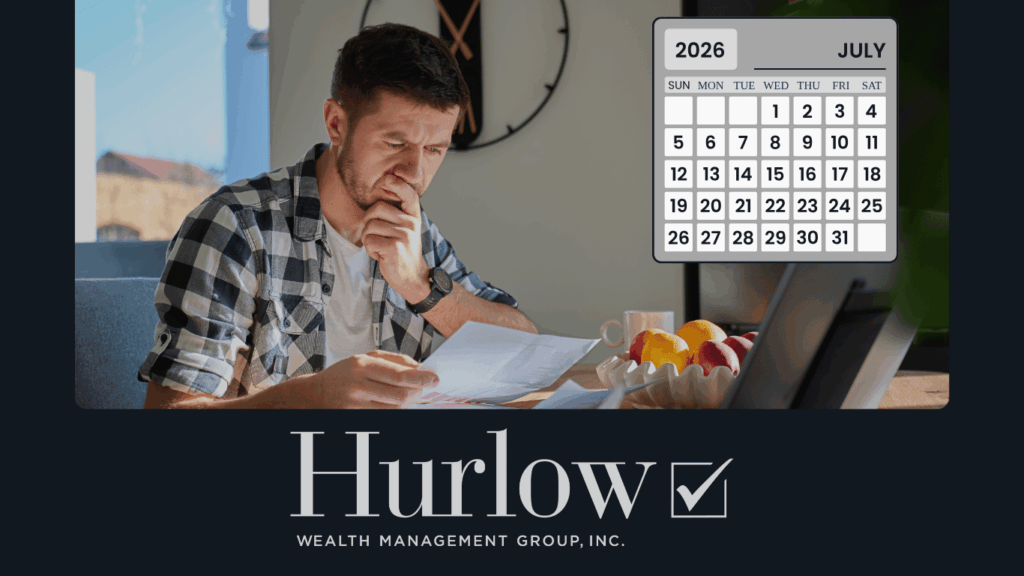 Man looking at financial statements at a table. Calendar shows July 2026