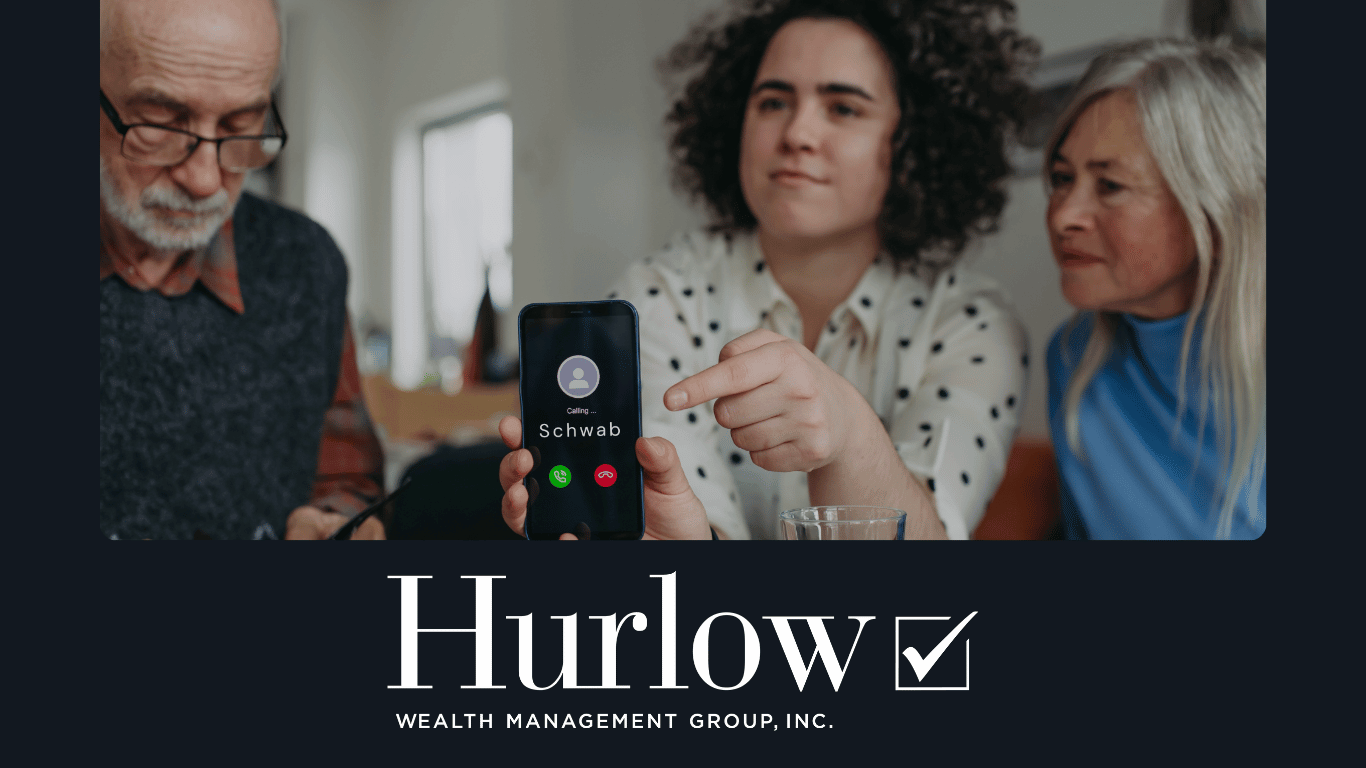 A young lady holds a phone that is dialling Schwab with her adult parents on either side of her