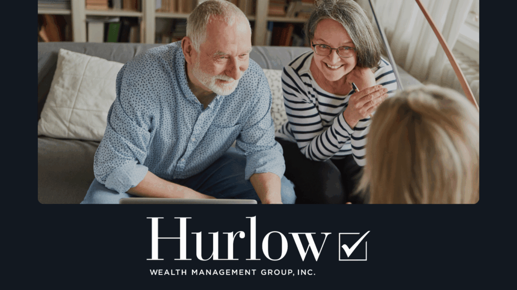 Couple sitting on a couch meeting with their financial planner