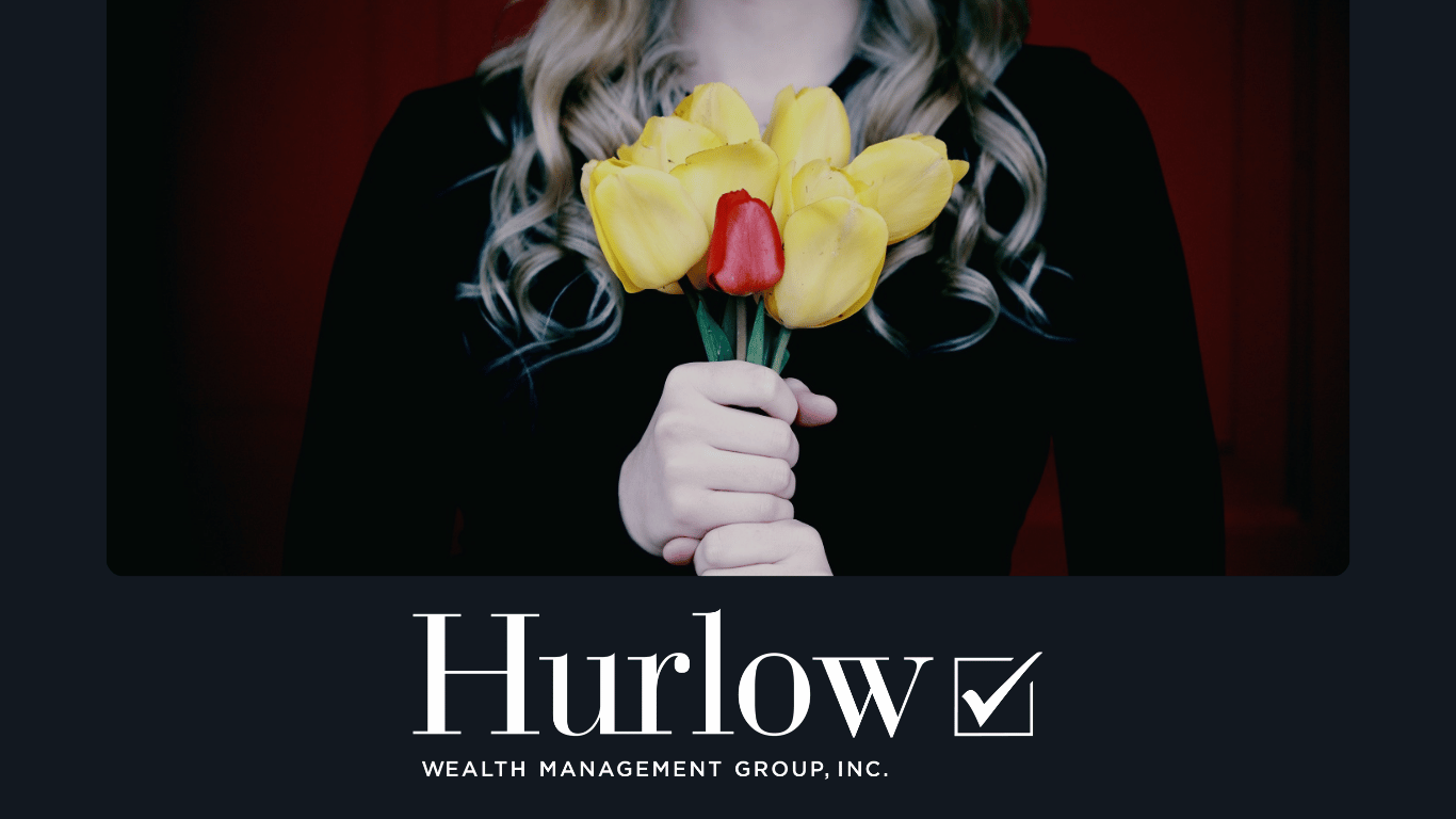 woman wearing black, holding flowers